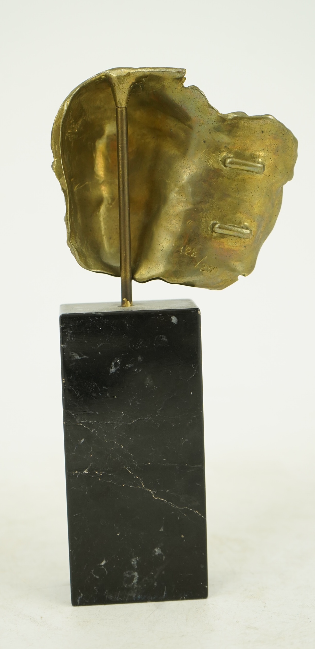 Igor Mitoraj (Polish, 1944-2014), Visage Envolé, bronze and black marble, 16.5 x 7 x 2.5cm